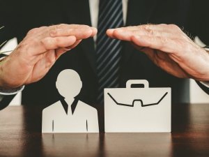 Insurer protecting an employee and a briefcase with his hands