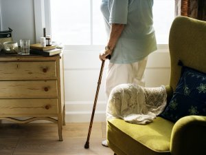 Senior woman standing alone in the room