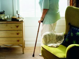 Senior woman standing alone in the room