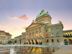 Panoramic view of square with fountain and Swiss Federal Parliament. Bern. Switzerland
