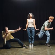 full length of young multiethnic actors rehearsing in different poses on stage of theater,stock image