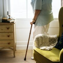 Senior woman standing alone in the room