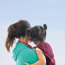 embracing a mother and a daughter, A lovely young girl embraces her mother.